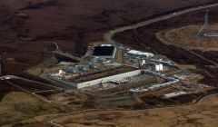 An aerial view of the Shetland Gas Plant as it takes shape, with the two large peat stores clearly visible.