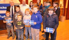 Councillors Theo and George Smith with bairns concerned about losing their leisure time if Aith junior high school should close. Photo BBC Radio Shetland