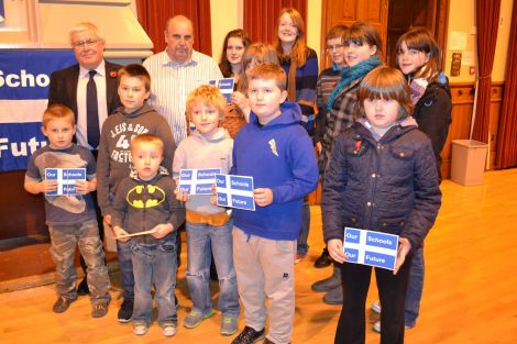 Councillors Theo and George Smith with bairns concerned about losing their leisure time if Aith junior high school should close. Photo BBC Radio Shetland