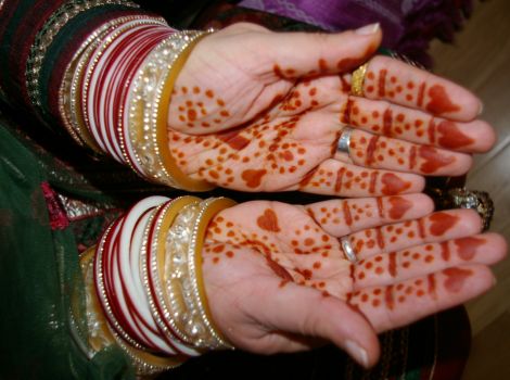 Rama's henna-painted hands from the Mendi, the pampering of the bride