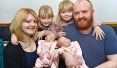 Overwhelmed but proud parents Kirsten and John Abernethy with their twin daughters - Photo: Malcolm Younger/Millgaet Media