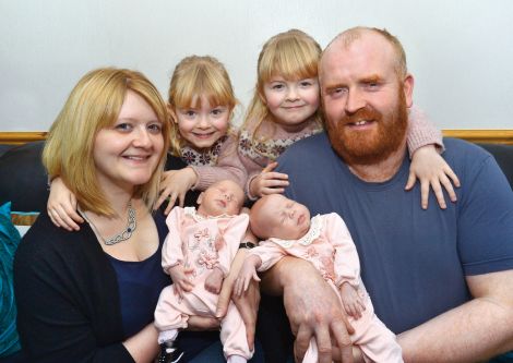 Overwhelmed but proud parents Kirsten and John Abernethy with their twin daughters - Photo: Malcolm Younger/Millgaet Media