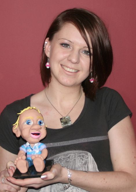 Self-made entrepreneur Donna Simpson with one of her popular Mootie Me bobble heads - Photo: Chris Cope