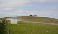 The Islander plane taking off from Papa Stour's airstrip. Photo courtesy of Jane Puckey.