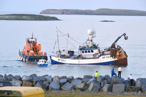 Prospect being towed by the Lerwick lifeboat shortly before she sank on 5 August last year. Photo Malcolm Younger