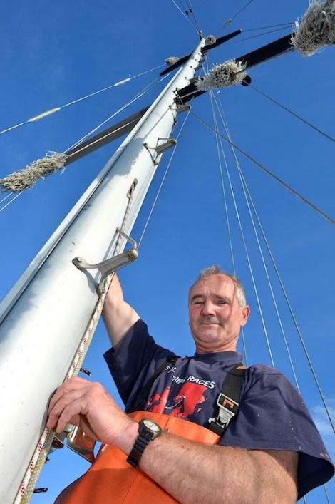 Andrew Halcrow working on his yacht in summer last year - Photo: Malcolm Younger/Millgaet Media