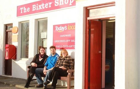 Kirsten and Steven Johnston, along with Steven's mother Margaret, take a well-earned breather outside the newly reopened Bixter Shop. Photo: Hans Marter/Shetnews.