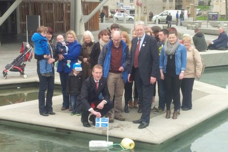 Tavish Scott launches Da Slockit Licht outside Holyrood. Photo CURE