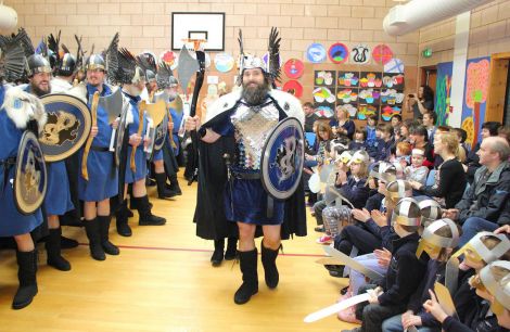 Brae Guizer Jarl Peter Peterson wows the bairns at Lunnasting primary at the start of a long and busy day and night. Photo Kevin Osborn