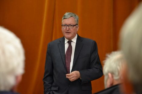 SNP minister Fergus Ewing speaking in Sandwick's Carnegie Hall on Monday night. Photo: Shetnews