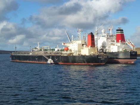 The British Tranquility transfers her cargo to the Island Express. Photo: John Bateson