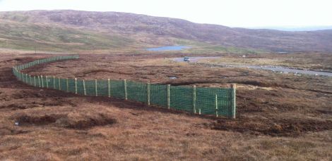 Northmavine's new snow fence ready to catch any last minute snow. Photo Shetnews