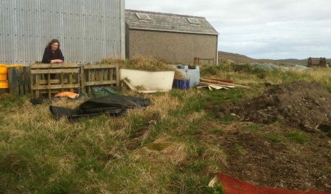 Jan Bevington of Hillswick Wildlife Sanctuary behind the local public toilets where she plans to create a wild garden. Photo Shetnews