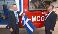 Local MP Alistair Carmichael and chief pilot Jimmy Livitt unveiling Oscar Charlie. Photo Millgaet Media