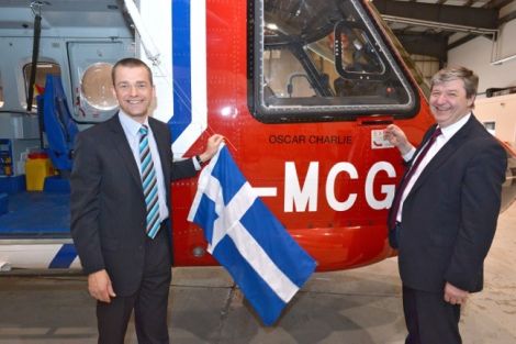 Local MP Alistair Carmichael and chief pilot Jimmy Livitt unveiling Oscar Charlie. Photo Millgaet Media