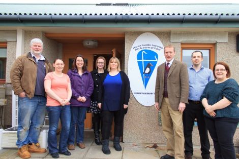 Shetland MSP Tavish Scott stands with Urafirth primary school parents fighting SIC closure plans. From left: Robin Sinclair, Charlene Johnston, Robyn Robertson, Pamela Ruddick, Clare Pottinger,Tavish Scott, Ryan Sandison and Claire Herridge.