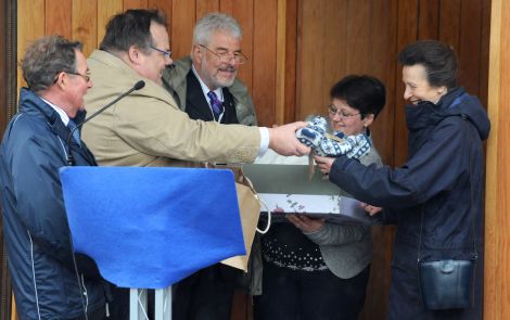 Amenity trust manager Jimmy Moncrieff presenting Princess Anne with a Burra Bear. Onlooking are trust vice-chair Captain George Sutherland (left), a former chairman of the Northern Lighthouse Board, trust chairman Brian Gregson (centre) and amenity trust employee Catriona Carter - Photo: Malcolm Younger/Millgaet Media.