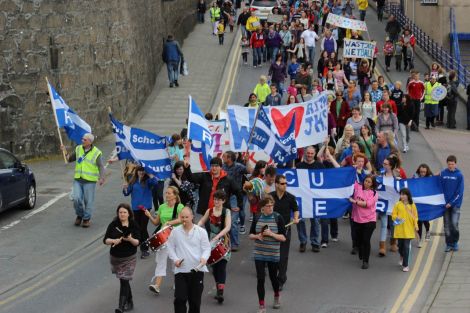 Aestaewest lead more than 600 marchers who had travelled the length and breadth of the isles to protest in Lerwick against SIC plans to close schools.