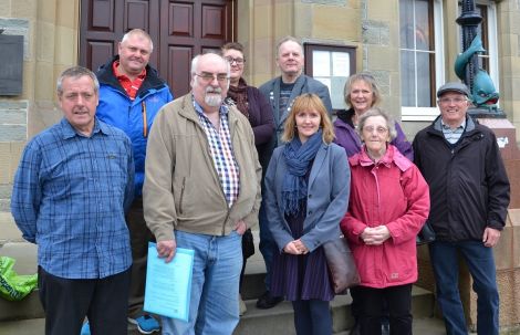 Parents and carers, pictured following the meeting, are "very pleased" that a new care centre will be built. Photo: Shetnews