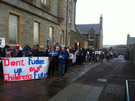 Angry protesters encircling Lerwick Town Hall last November when the council voted to consult on Don Ledingham's S1-2 suggestion. Photo Shetnews