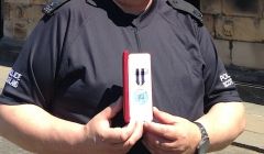 Special constable Peter Smith with his Queen's Police Medal outside Holyrood Palace on Tuesday.