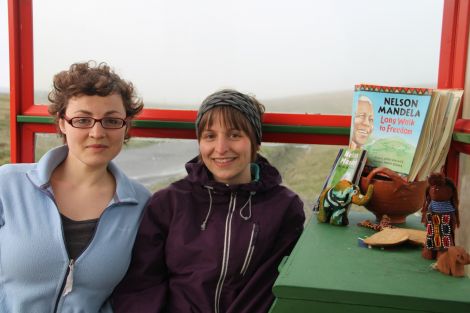 UWC Short Course project coordinator Undine Schmidt with Bethany Scott in Bobby's Bus Shelter at Baltasound.