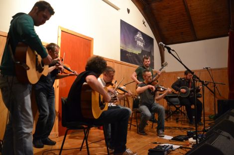 In full flow at Fetlar on Saturday night, from left: Jonny Polson, Ewen Thomson, Kris Drever, Maurice Henderson, Peter Gear, Bryan Peterson and Lewie Peterson. Photo: Shetnews