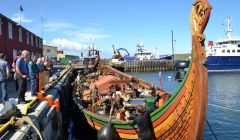 The crew of the Draken Harald enjoyed bright sunshine as they tidied up the longship on Monday. Photo: Shetnews/Neil Riddell