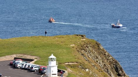 Lifeboat towing Good Shepherd to Grutness Pier - Photo: Ronnie Robertson