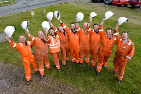 Nine of the 10 workmates who are limbering up for an 80-mile, non stop walk the length of Shetland. Photo: Malcolm Younger