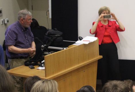 Nicola Sturgeon takes a photo of the audience before addressing them on Wednesday night, while BBC engineer John Waters packs up his equipment after the debate.