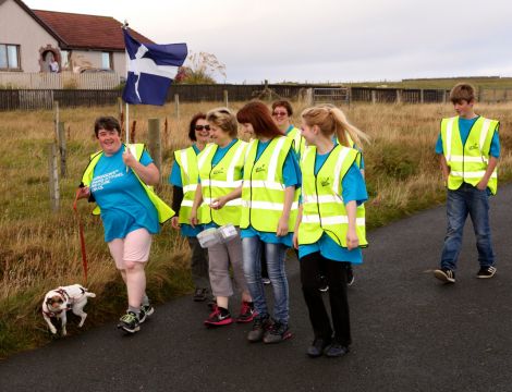 Liz Peterson out on the walk, along with her Jack Russell and friends, on Sunday. Photo: Barry Broadbent