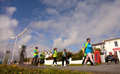 Liz and co. walking through Bixter en route from Sandness to Lerwick. Photo: Barry Broadbent