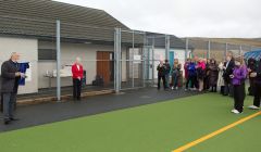 Shetland Recreational Trust chairman Joe Irvine speaking to the invited guests at the official opening of the Shetland Regional Hockey Centre on Saturday morning in Brae. Photo courtesy of SRT.