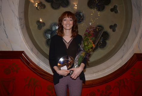 A proud Michelle Henderson received the award on behalf of her late father. Photo: Louis DeCarlo