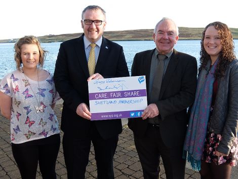 SIC leader Gary Robinson (second from left) and NHS Shetland chairman Ian Kinniburgh (third from left) with Scottish Youth Parliament members Catherine Hannah (left) and Kaylee Mouat (right). Photo courtesy of SIC.