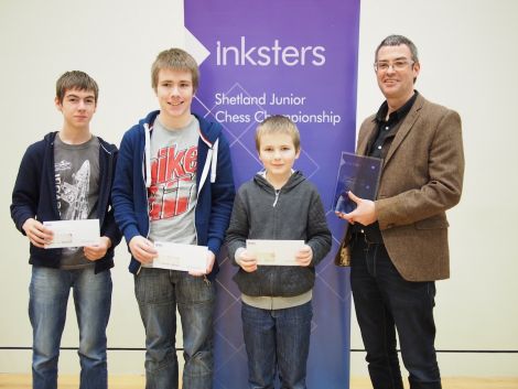 Sponsor Brian Inkster with the joint Shetland Junior Chess Champions for 2014 – Duncan Burgess, Leon Riise and Luke Riise.