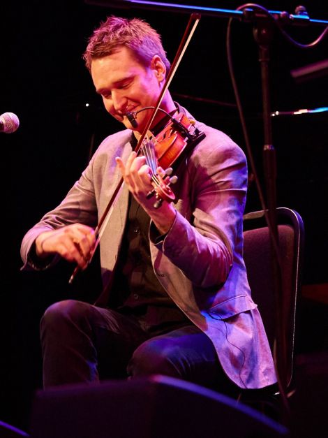 A sharply-dressed Kevin Henderson playing with Boys of the Lough as part of the weekend envisioned by his late father Davie. Photo: Chris Brown