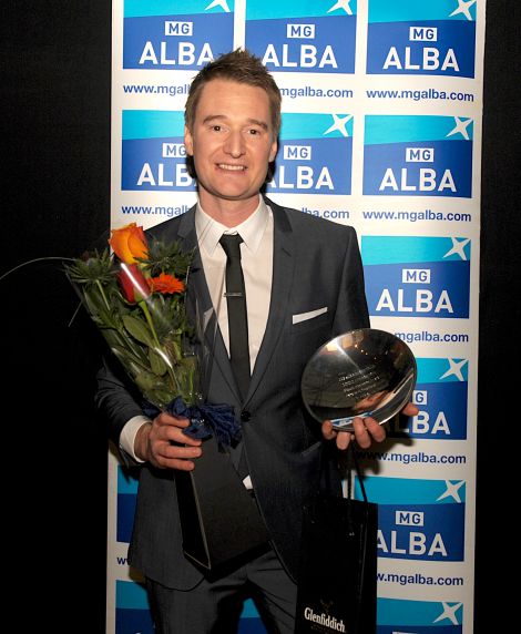 Kevin Henderson with his father Davie's award at the Scottish Trad Music Awards on Saturday night. Photo: Louis DeCarlo