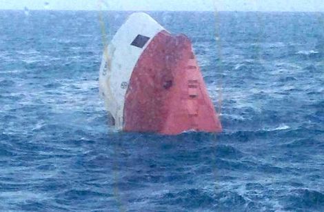 The capsized wreck of the Cemfjord before it sank.