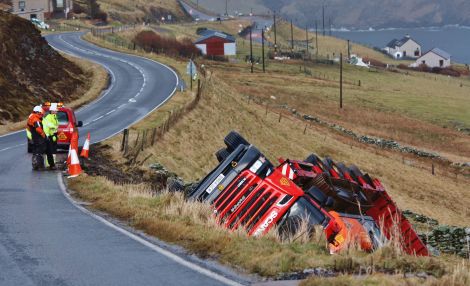 The Garriock Brothers low loader lying off the road down the embankment at Levenwick on Tuesday morning Photo Ronnie Robertson