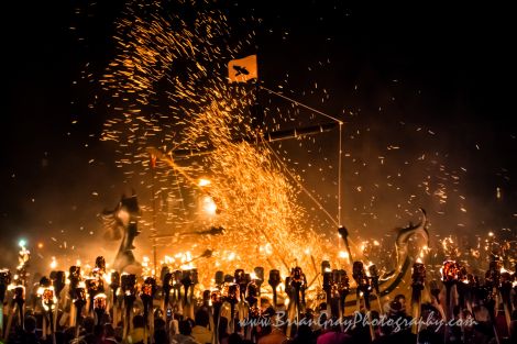 The trademark centrepiece of the evening procession, as the galley takes light in Lerwick's playing park. Photo: Brian Gray