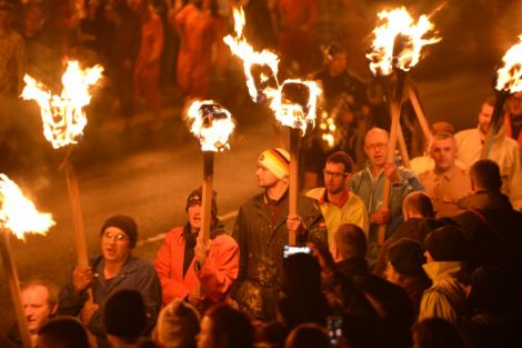 Torch-carrying guizers parading around Lerwick ahead of the galley burning. Photo: Shetnews