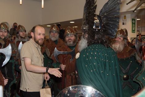 Shetland Museum curator Ian Tait greets the Jarl's Squad on Tuesday afternoon. Photo: Shetnews