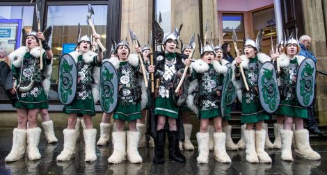 Lerwick Up Helly Aa's 2015 junior Guizer Jarl Lewis Harkness and his squad on Commercial Street. Photo: Craig Sim