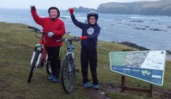 Joshua Painter and Kieran Brown at the Banks of Funzie after cycling 7.5 miles for the Water Aid charity.