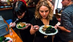 Shetland Night in London organiser Helen Nisbet tucking in to some mutton and seaweed pie and kale. Photo: Joe Plommer.