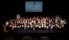 Many of the volunteers on stage at Mareel with their awards on Monday night.