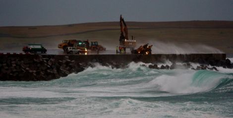 Last December emergency services had to rescue a trapped digger driver who was carrying out repair work on the runway. Photo: Ronnie Robertson