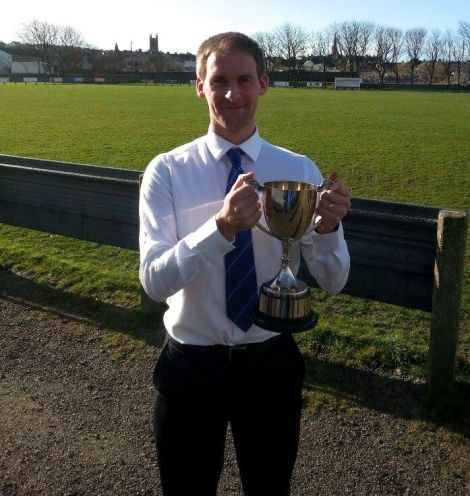 Victorious captain, goalscorer and man of the match Leighton Flaws with the trophy after Saturday's win. Photo: Michael Duncan